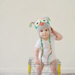 toddler standing on basket