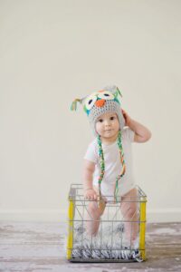 toddler standing on basket