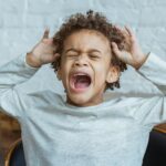 desperate screaming young boy
