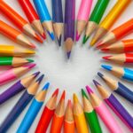 set of coloring pencils forming heart