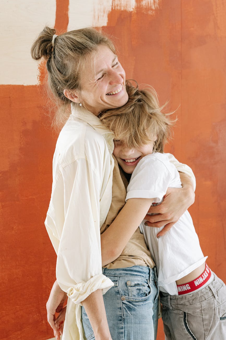 a mother and son hugging